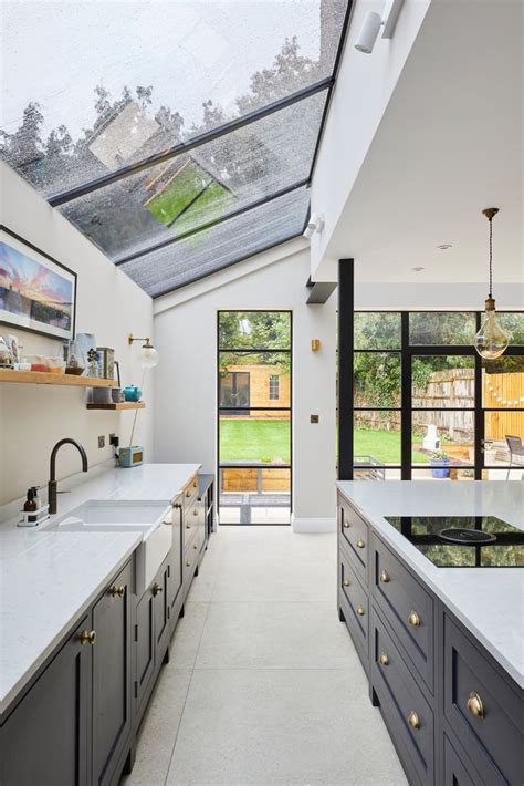 A Kitchen With An Open Skylight Above It