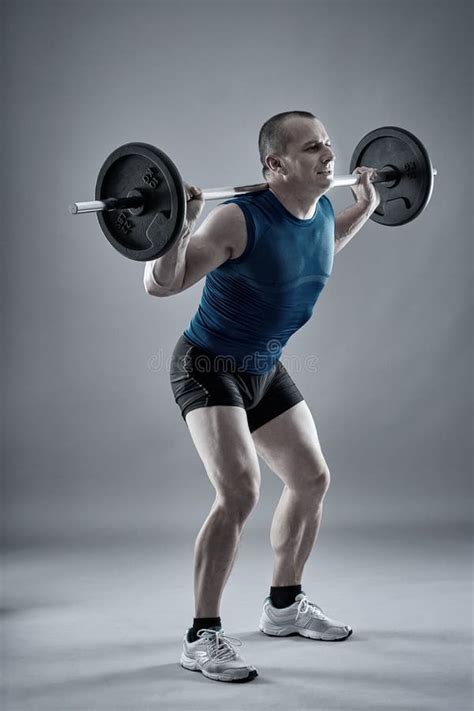 Man Doing Squats With Barbell Stock Photo Image Of Fitness Muscular