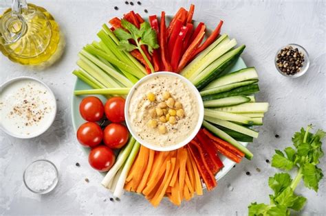 Premium Photo Plate Of Colorful Fresh Vegetable Sticks With Hummus