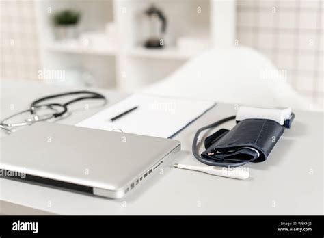 Workplace Of Doctor With Laptop Stethoscope And Notebook On Wooden