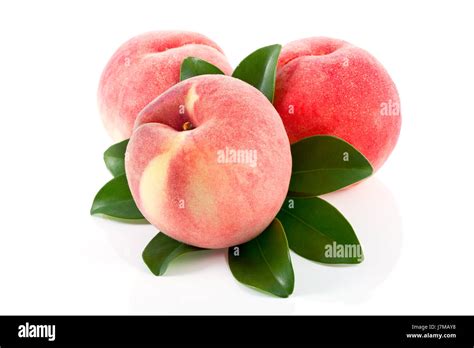 Ripe Peach Fruits With Green Leaves Isolated On White Background Stock