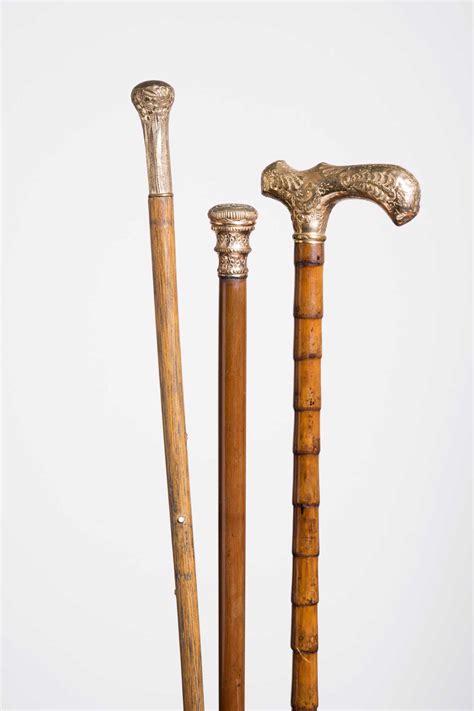 Three Gold Handled Canes