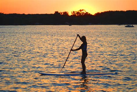 My Sister Paddle Boarding At Sunset On Crooked Lake Angola In