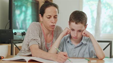 Mother Helping Her Son To Do His Homework At Home Stock Footage Video Of Help Mother 126663698