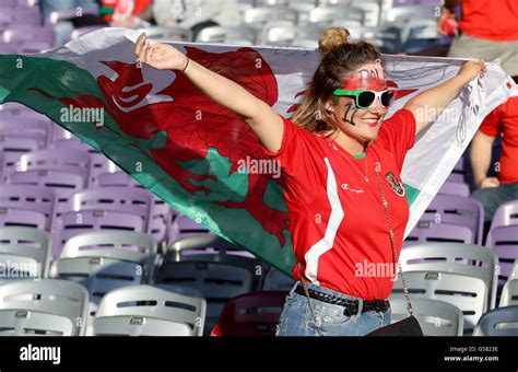 A Wales Fan In The Stands Shows Her Support Prior To Kick Off During