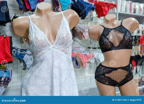 Two Mannequins Dressed In Beautiful White And Black Lace Women S