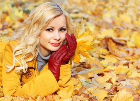 Autumn Girl Fashion Blonde Beautiful Woman With Maple Leaves In Stock