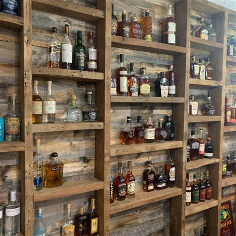 Bourbon display with reclaimed wood home bar | Basement bar designs ...