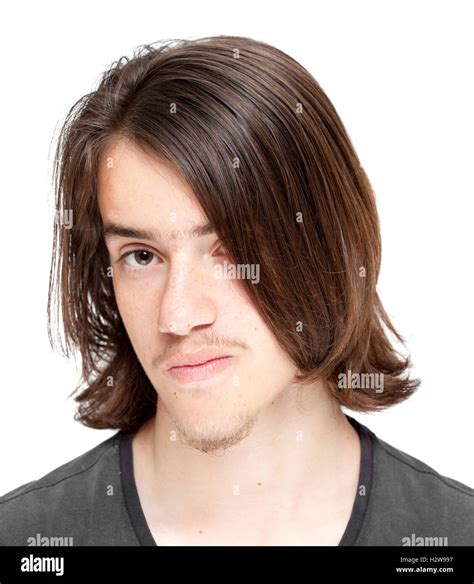 teenage boy with long dark hair isolated on white background Stock ...