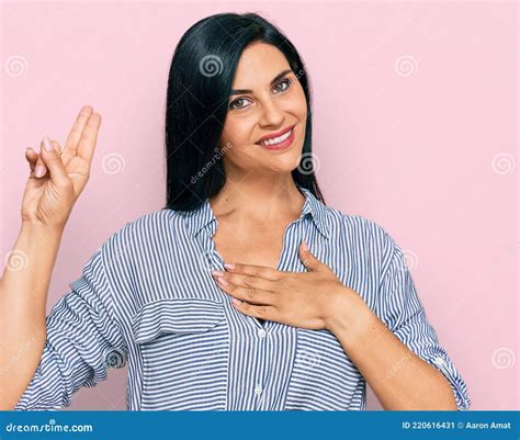 Young Caucasian Woman Wearing Casual Clothes Smiling Swearing With Hand