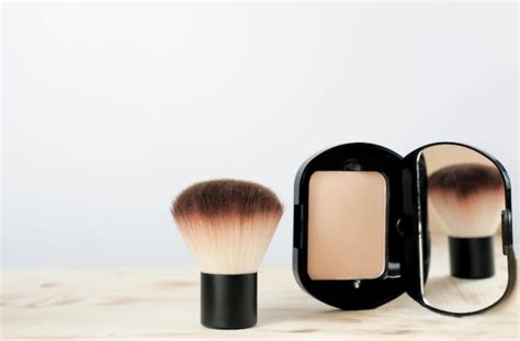 Premium Photo | Compact foundation powder with brush