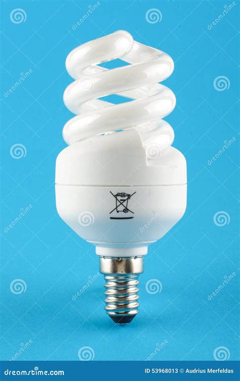 Compact Fluorescent Energy Saving Light Bulb Isolated On The Blue