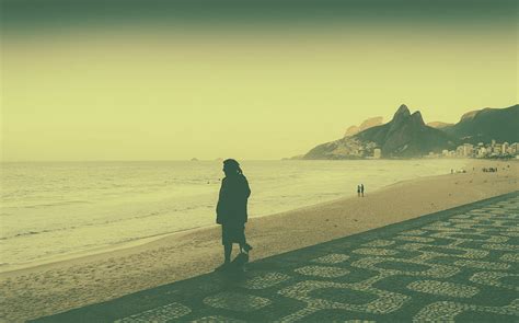 Lonely man on the beach Photograph by Alexandre Rotenberg