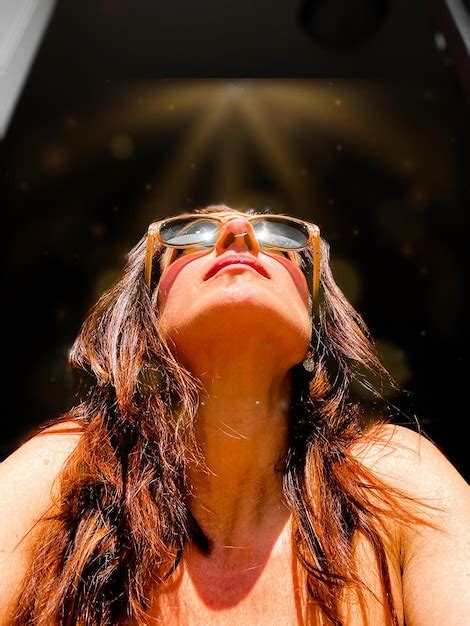 Premium Photo Low Angle View Of Woman Wearing Sunglasses Looking Away