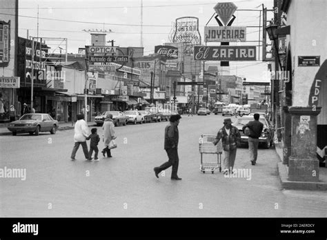 Ciudad Juarez, Chihuahua, Mexico - February, 1986: Archival view of buildings, stores, traffic ...