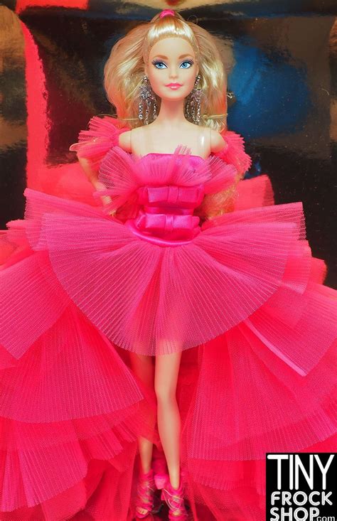 The Barbie Doll Is Wearing A Pink Dress