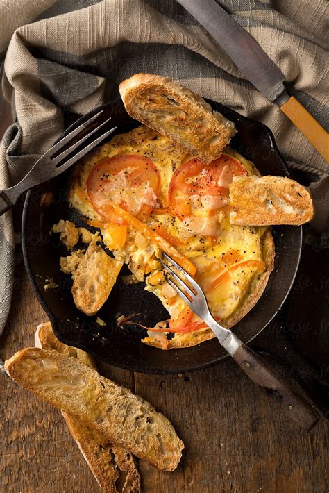 Tomato Frittata In Cast Iron Pan By Stocksy Contributor Jeff