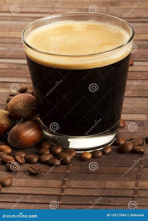 Espresso Coffee In A Short Glass With Hazelnuts Stock Photo Image Of