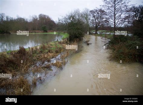 River Deben In Bankfull Stage With Levee On River Bank And Water On