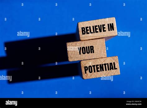 Believe In Your Potential Words Written On Wooden Blocks With Blue