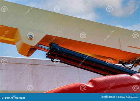 Closeup Hydraulic Of Boom Lift Orange Articulated Boom Lift