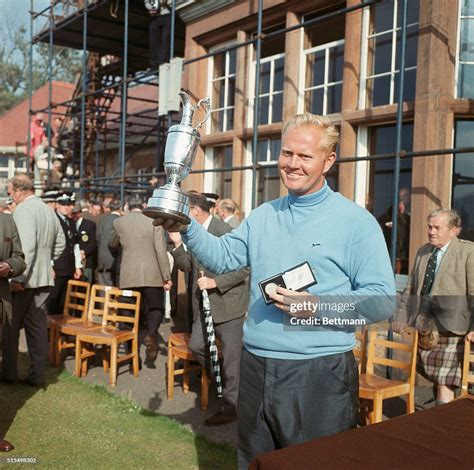 Jack Nicklaus proudly stands with his trophy after his victory in the ...