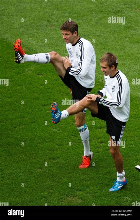 Germanys Captain Philipp Lahm Right Smiles During The Training Session