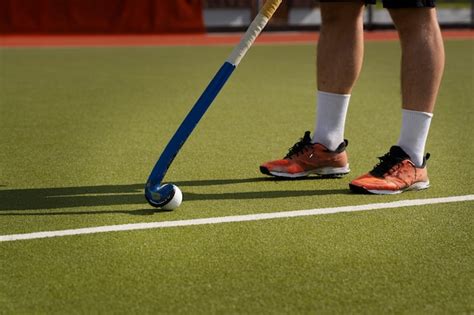 Free Photo Hockey Player During A Match On The Grass