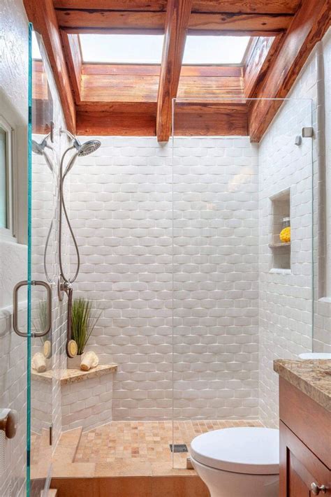 A Bathroom With A Glass Shower Door And Wooden Ceiling Beams In The