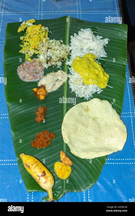 Traditional Kerala Food Laid Out On A Banana Leaf During The Onam