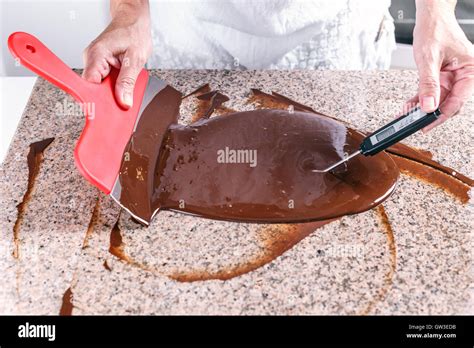 Measuring temperature of melted chocolate Stock Photo - Alamy