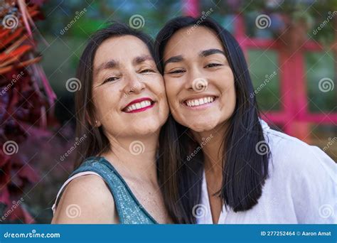 Two Women Mother And Daughter Smiling Confident Standing Together At