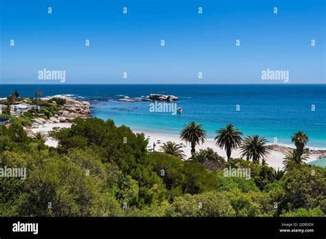 Overview of tropical vegetation and rocky shore with beachfront homes along the Atlantic Ocean ...