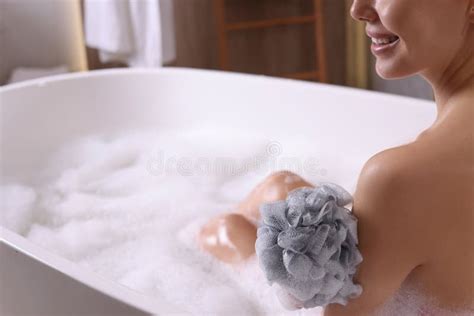 Woman Taking Bath With Mesh Pouf In Tub Closeup Stock Image Image Of