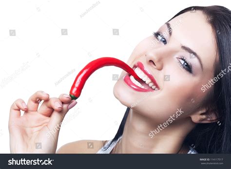Happy Brunette Woman Biting Chili Pepper Stock Photo 114117517