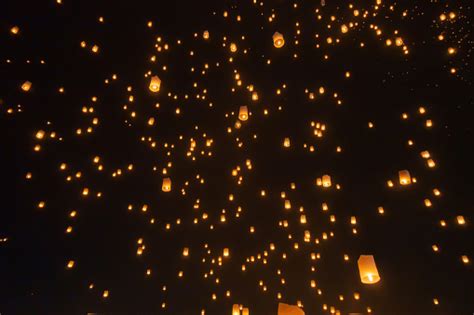 Thai People Release Sky Floating Lanterns Or Lamp To Worship Buddhas