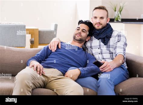 Gay Couple Watching Television Stock Photo Alamy