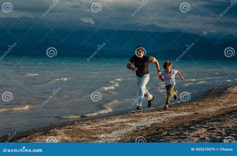 Father And Son Running On Sandy Beach At Summer Stock Image Image Of