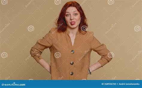 Cheerful Funny Bully Woman Showing Tongue Making Silly Faces Fooling