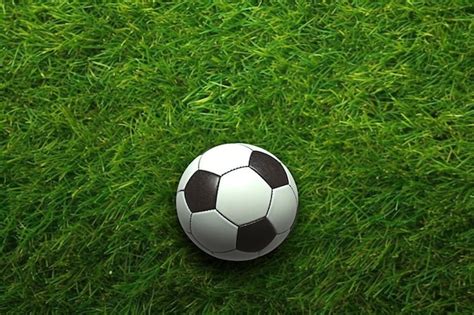 Premium Ai Image A Soccer Ball On The Grass With A White And Black