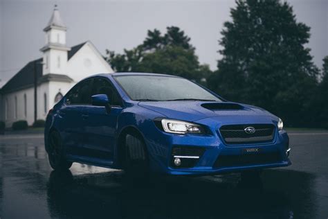 Download Royal Blue Glossy Subaru Wrx Sti 4k Unleashing Dynamic Power Wallpaper