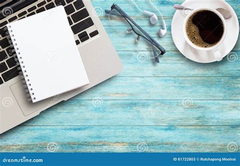 Office Desk With Laptop Coffee And Glasses On Wooden Stock Image