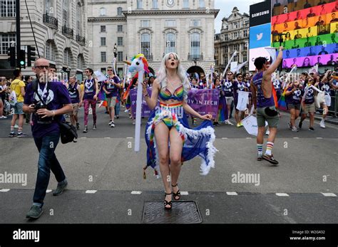 A Participant Marches With A Unicorn Inflatable During The Pride In