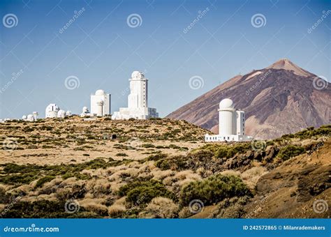 Telescopes And Domes Of Observatory In The Night Sky With Stars