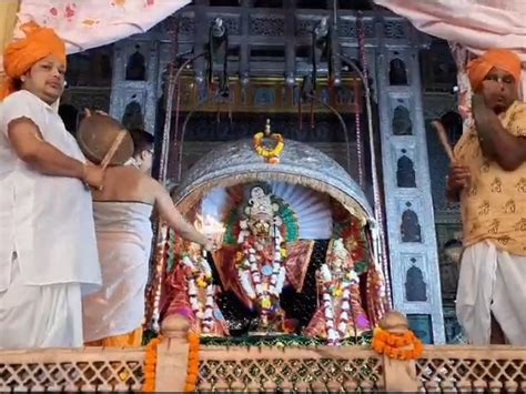 Lord Madan Mohan Sitting In A Silver Carousel On Teej तीज पर चांदी के