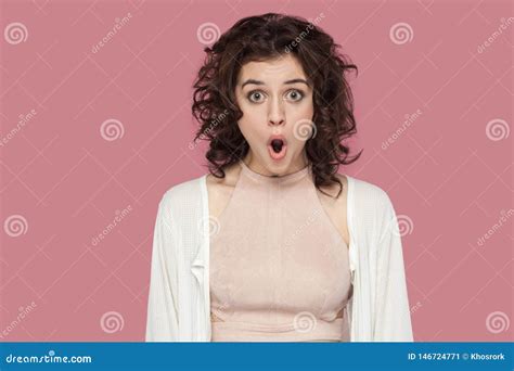 Closeup Portrait Of Surprised Brunette Young Woman With Curly Hairstyle