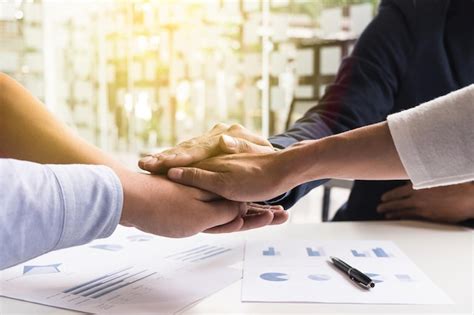 Premium Photo Cropped Image Of Business People Stacking Hands