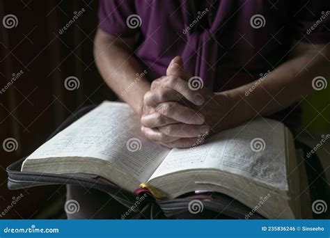 Senior Woman Hands On Open Bible Praying Stock Photo Image Of Blur