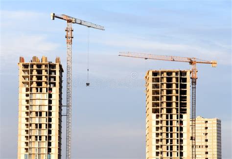 Preparing To Pour A Bucket Of Concrete Into Formworktower Crane