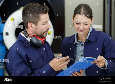 Female Aero Engineer Working On Helicopter In Hangar Stock Photo Alamy